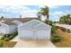 House exterior with double garage and landscaped front yard at 502 Woodstork Cir, Bradenton, FL 34209