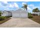 Front view of house with double garage and driveway at 502 Woodstork Cir, Bradenton, FL 34209