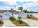 House exterior with double garage and landscaped front yard at 502 Woodstork Cir, Bradenton, FL 34209