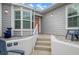 Inviting front entry with steps leading to the front door and a small patio area at 502 Woodstork Cir, Bradenton, FL 34209