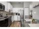 Modern kitchen with stainless steel appliances and white shaker cabinets at 502 Woodstork Cir, Bradenton, FL 34209