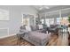 Comfortable living room with a sectional sofa, wood floors and access to a private sunroom at 502 Woodstork Cir, Bradenton, FL 34209