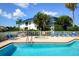 Community pool and spa with ample lounge chairs at 502 Woodstork Cir, Bradenton, FL 34209