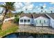 View of the canal-front home with a private deck at 502 Woodstork Cir, Bradenton, FL 34209
