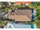 Aerial view of the home showcasing the tile roof and pool at 5159 Oxford Dr, Sarasota, FL 34242