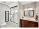 Bathroom featuring a sliding glass shower door, modern vanity, and a neutral color scheme at 5159 Oxford Dr, Sarasota, FL 34242
