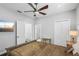 Comfortable bedroom with ensuite bathroom and a ceiling fan at 5159 Oxford Dr, Sarasota, FL 34242