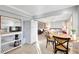 Small kitchen with microwave and refrigerator, visible from the dining area at 521 Cummings St, Sarasota, FL 34242