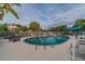 Community pool with lounge chairs and palm trees at 5531 2Nd Avenue W Cir, Palmetto, FL 34221
