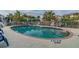 Community pool with lounge chairs and palm trees at 5531 2Nd Avenue W Cir, Palmetto, FL 34221