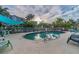 Community pool with lounge chairs and palm trees at 5531 2Nd Avenue W Cir, Palmetto, FL 34221
