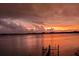 Stunning sunset over calm water with a dock in the foreground at 5531 2Nd Avenue W Cir, Palmetto, FL 34221