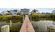Stunning waterfront view with a private dock leading to beautifully designed coastal homes at 5531 2Nd Avenue W Cir, Palmetto, FL 34221