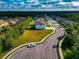 Aerial view of a residential community with a house and empty lot at 7404 Mill Hopper Ct, Palmetto, FL 34221