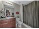 Bathroom with shower/tub combo, toilet and vanity at 7404 Mill Hopper Ct, Palmetto, FL 34221