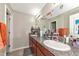 Double vanity bathroom with granite countertops at 7404 Mill Hopper Ct, Palmetto, FL 34221