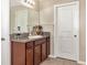 Bathroom with vanity, mirror, and tiled floor at 7404 Mill Hopper Ct, Palmetto, FL 34221