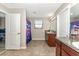 Bathroom with double vanity and shower at 7404 Mill Hopper Ct, Palmetto, FL 34221