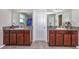 Double vanity bathroom with granite countertops and ample storage at 7404 Mill Hopper Ct, Palmetto, FL 34221