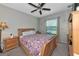 Cozy bedroom with a double bed and wood furniture at 7404 Mill Hopper Ct, Palmetto, FL 34221