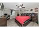 Spacious bedroom with a large bed and dark brown dresser at 7404 Mill Hopper Ct, Palmetto, FL 34221