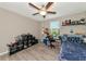 Bright bedroom with a bed, desk, and plenty of storage at 7404 Mill Hopper Ct, Palmetto, FL 34221