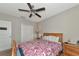 Well-lit bedroom with a double bed and ceiling fan at 7404 Mill Hopper Ct, Palmetto, FL 34221