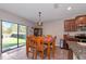 Dining area with table and chairs, adjacent to kitchen at 7404 Mill Hopper Ct, Palmetto, FL 34221