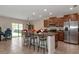 Kitchen with island, stainless steel appliances, and granite countertops at 7404 Mill Hopper Ct, Palmetto, FL 34221