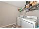 Laundry room with washer, dryer, and shelving for storage at 7404 Mill Hopper Ct, Palmetto, FL 34221