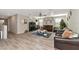 Bright living room featuring hardwood floors and comfortable seating at 7404 Mill Hopper Ct, Palmetto, FL 34221