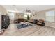 Bright living room featuring hardwood floors and comfortable seating at 7404 Mill Hopper Ct, Palmetto, FL 34221