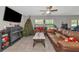 Spacious living room featuring a fireplace and comfortable seating at 7404 Mill Hopper Ct, Palmetto, FL 34221