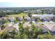 Aerial view of houses and golf course community at 8472 Gateway Ct, Englewood, FL 34224