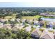 Aerial view of houses and golf course community at 8472 Gateway Ct, Englewood, FL 34224