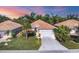 Attractive single-Gathering home with a two-car garage, nicely landscaped yard, and desirable curb appeal at 8472 Gateway Ct, Englewood, FL 34224