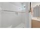 Clean bathroom with shower and tiled walls at 8472 Gateway Ct, Englewood, FL 34224