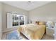 Bedroom with large window, ceiling fan, and window seat at 8472 Gateway Ct, Englewood, FL 34224