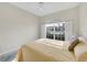 Bedroom with large window and view of the water at 8472 Gateway Ct, Englewood, FL 34224