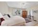 Bright bedroom with large window, ceiling fan, and ample floor space at 8472 Gateway Ct, Englewood, FL 34224