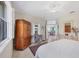 Spacious bedroom with large window and access to living area at 8472 Gateway Ct, Englewood, FL 34224