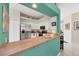 Kitchen features a breakfast bar and stainless steel appliances at 8472 Gateway Ct, Englewood, FL 34224