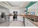 Modern kitchen with stainless steel appliances and ample counter space at 8472 Gateway Ct, Englewood, FL 34224