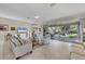 Spacious living area with sliding glass doors that open to a private backyard patio at 8472 Gateway Ct, Englewood, FL 34224