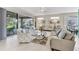 Relaxing living room with a view of the backyard and sliding glass doors leading to a patio at 8472 Gateway Ct, Englewood, FL 34224