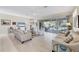 Spacious living room with ample natural light and comfortable seating at 8472 Gateway Ct, Englewood, FL 34224
