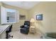 Bright office with window and comfortable seating at 8472 Gateway Ct, Englewood, FL 34224