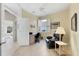 Home office with built-in desk and comfortable chair at 8472 Gateway Ct, Englewood, FL 34224