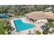 Community pool with plenty of lounge chairs at 8472 Gateway Ct, Englewood, FL 34224