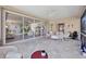 Large screened porch with view of living room and backyard at 8472 Gateway Ct, Englewood, FL 34224